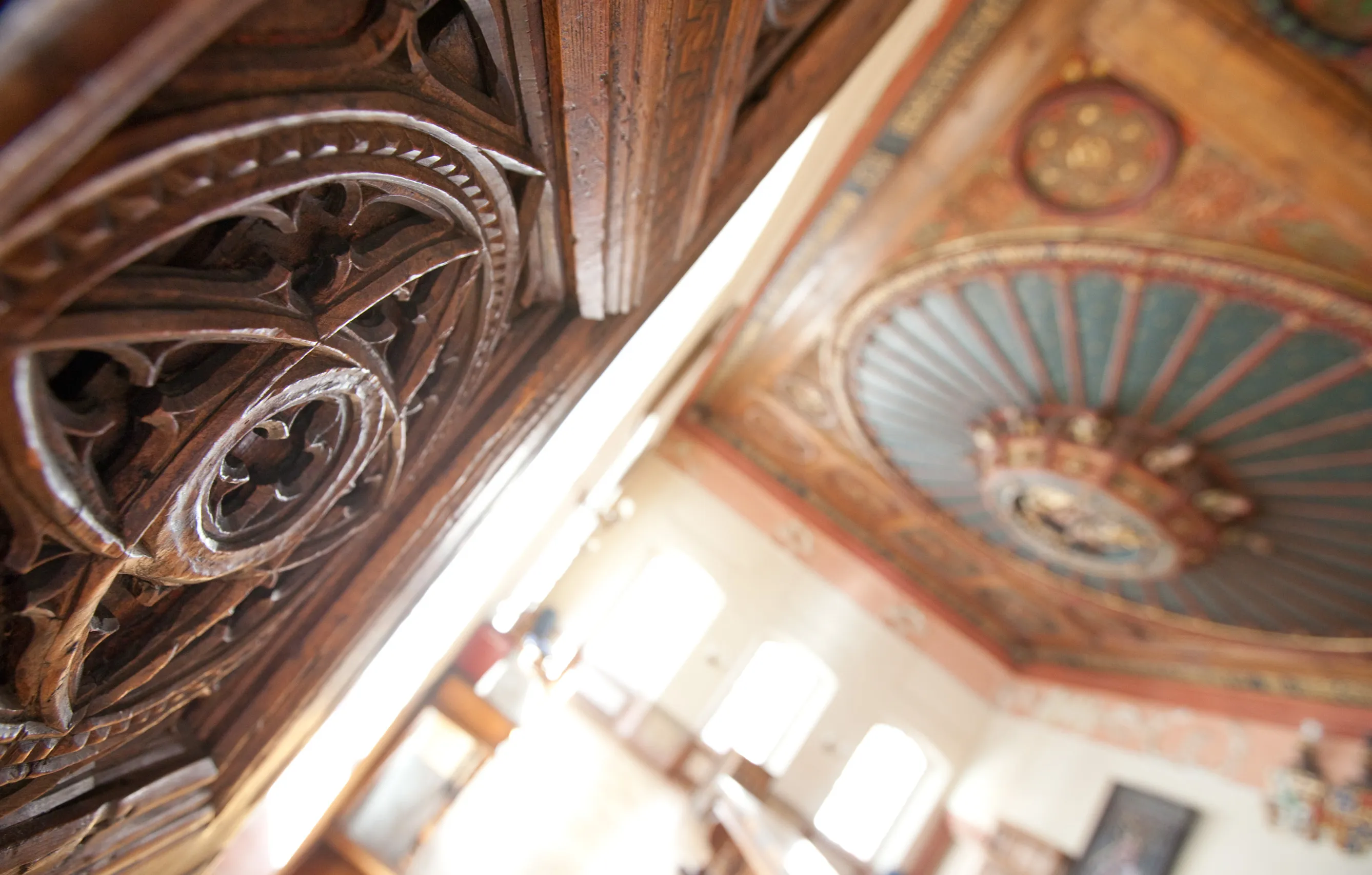 Carved wood, painted ceiling, historical architecture.